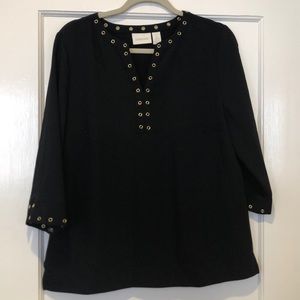 Black split neck top with gold grommet detail